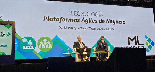 Panel discussion on Agile Business Platforms featuring Daniel Padin and Walter Luque of Zeetrex, with a presentation backdrop displaying the event title and logo.