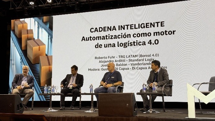 Panel discussion on automation in logistics 4.0 featuring four speakers and a backdrop displaying the event title and theme.